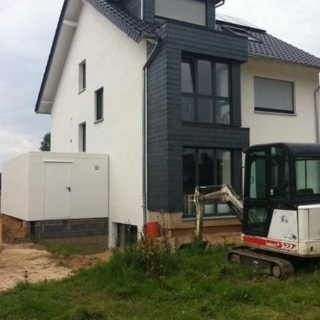 Neubau mit Tonziegeleindeckung und Schieferverkleidung